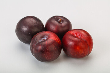 Ripe sweet plum fruit heap