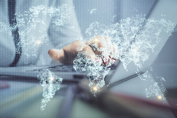 Double exposure of woman hands typing on computer and social network theme hologram drawing. People...