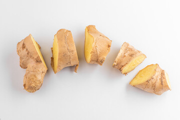 Top view on a freshly cut ginger root on white background