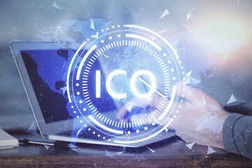 Double exposure of man's hands holding and using a phone and crypto currency blockchain theme...