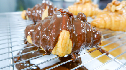 croissant on top sauce chocolate caramel
