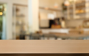 Empty wooden table in front of abstract blurred background of coffee shop . can be used for display or montage your products.Mock up for display of product
