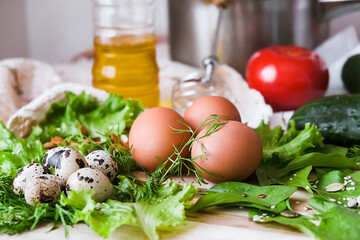 chicken eggs lie on a table with greens healthy natural farm food