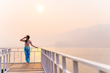 Summer lifestyle tropical beach vacation. Happy traveller asian woman with tanned in swimwear at Beach