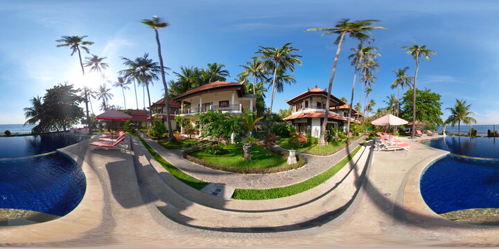 vr 360 swimming pool in luxury hotel with sun beds by sea. tropical resort with pool. Travel concept.