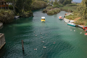 pedal boats and boats on the Turtle River in Georgioupolis on Crete island (Greece) 