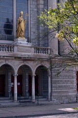 St Patrick Statue on Stone Church Facade in Daylight
