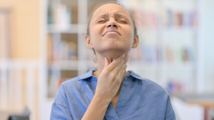 Naklejka premium Portrait of Sick African Woman Coughing