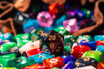 Fototapeta na wymiar Close-up of a d20 on a pile of dice