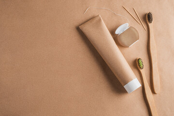 Set of organic toothpaste, bamboo toothbrushes, toothpicks and dental floss