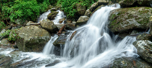 Fototapeta premium Panoramic beautiful deep forest waterfall in Thailand.