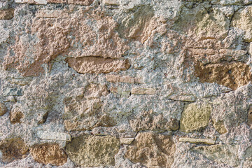 Old grungy retro dirty faded brick wall of ancient city. Uneven pitted peeled surface brickwork of cellar worn. Ruined shabby stiff blocks.Hard solid messy ragged holes brickwall of 3D grunge design