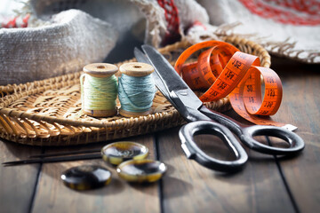 Fototapeta na wymiar Threads, needles and sewing items.