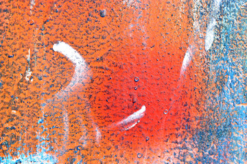 The metal surface painted with multicolored colors speckles and stripes is sloppy