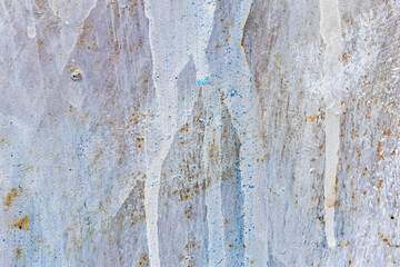 The metal surface painted with multicolored colors speckles and stripes is sloppy