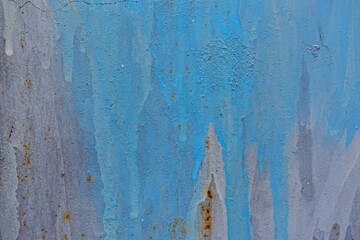 The metal surface painted with multicolored colors speckles and stripes is sloppy