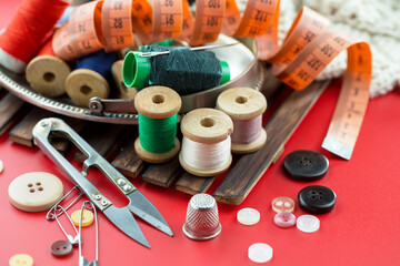 Threads, needles and sewing items.