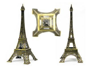 Bronze Eiffel Tower toy isolated on white background