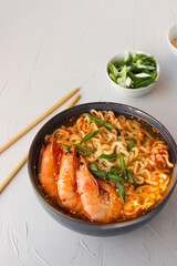 Ramen soup with prawns and green onions.