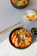 Ramen soup with prawns and green onions.