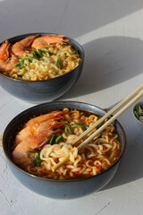 Ramen soup with prawns and green onions.