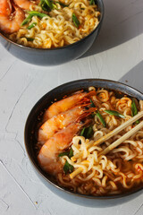 Ramen soup with prawns and green onions.