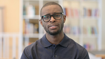 Obraz premium Portrait of Young African Man reacting to Loss, Failure