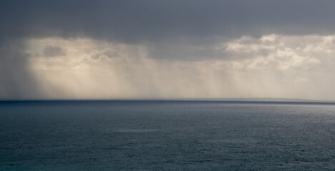 Fototapeta premium Stormy sky with dramatic clouds and sea. Stormy weather at the ocean