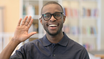 Portrait of Cheerful Young African Man Waving, Hello