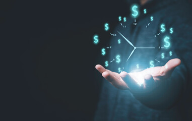 Businessman holding virtual clock with dollar sign for money and time management concept.