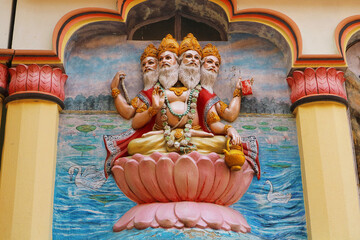View of wall art of Hindu god Brahma. Brahma, the four-headed lord, sits on a lotus flower....