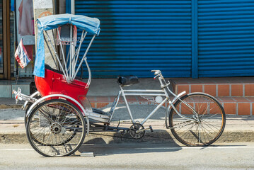 Old bike rickshaw rikshaw trishaw in Don Mueang Bangkok Thailand.