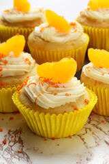 vanilla buttercream cupcake with orange