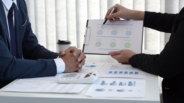 Financial inspector calculating a numbers in office room.