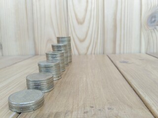 Fototapeta na wymiar Coins on tne wooden background