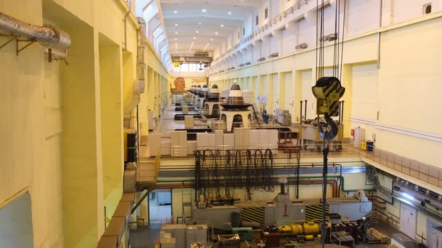 Huge turbines in a row inside of Novosibirsk hydroelectric power plant station on the Ob River