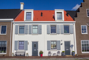 White house with gray shutters in Blauwestad