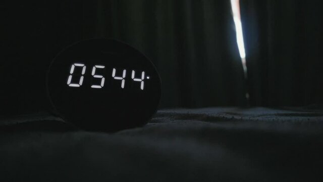 morning alarm clock in a dark room