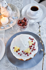 Easter decoration, candles and bunny and lemon biscuit