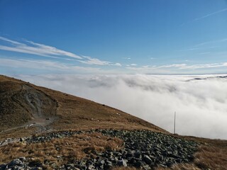 Mountain ridge just above the clouds © LucasB