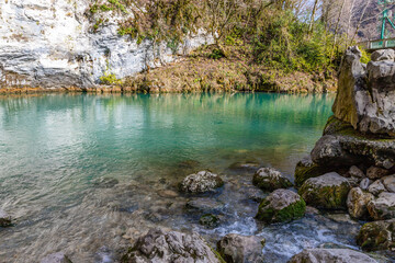 Blue lake on the road to Ritsa lake. Small lake with emerald water color on the right bank of river Bzyb. Abkhazia
