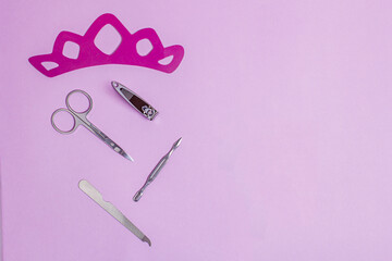 accessories from a cosmetic set for nail care on a pink background. copy space.