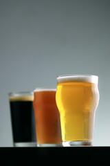 Three glasses of craft beer with different colors