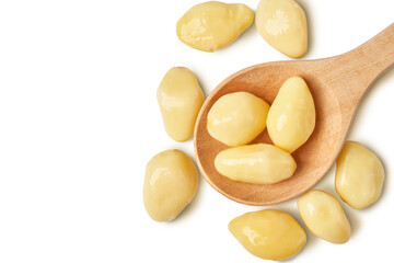 ginkgo biloba seed in wooden spoon isolated on white background with clipping path. top view, flat lay                           
