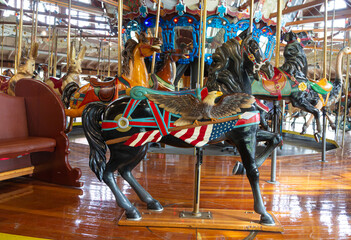 Fototapeta na wymiar Carousal horses on Merry Go Round.