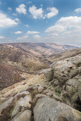 The steep slope of the valley with a landslide of rocks in the hills of Kinder Scout in the Peak District National Park, United Kingdom.