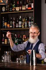 Portrait elderly bartender man with fresh delicious cocktail