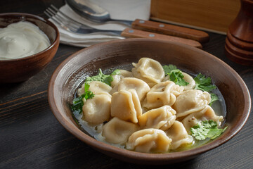 Meat dumplings with sour cream. Pelmeni russian national dish