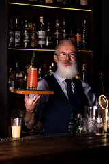 senor bartender with a bloody mary cocktail