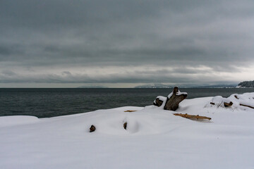 Snow blankets the beach on Whidbey Island after winter snowstorm